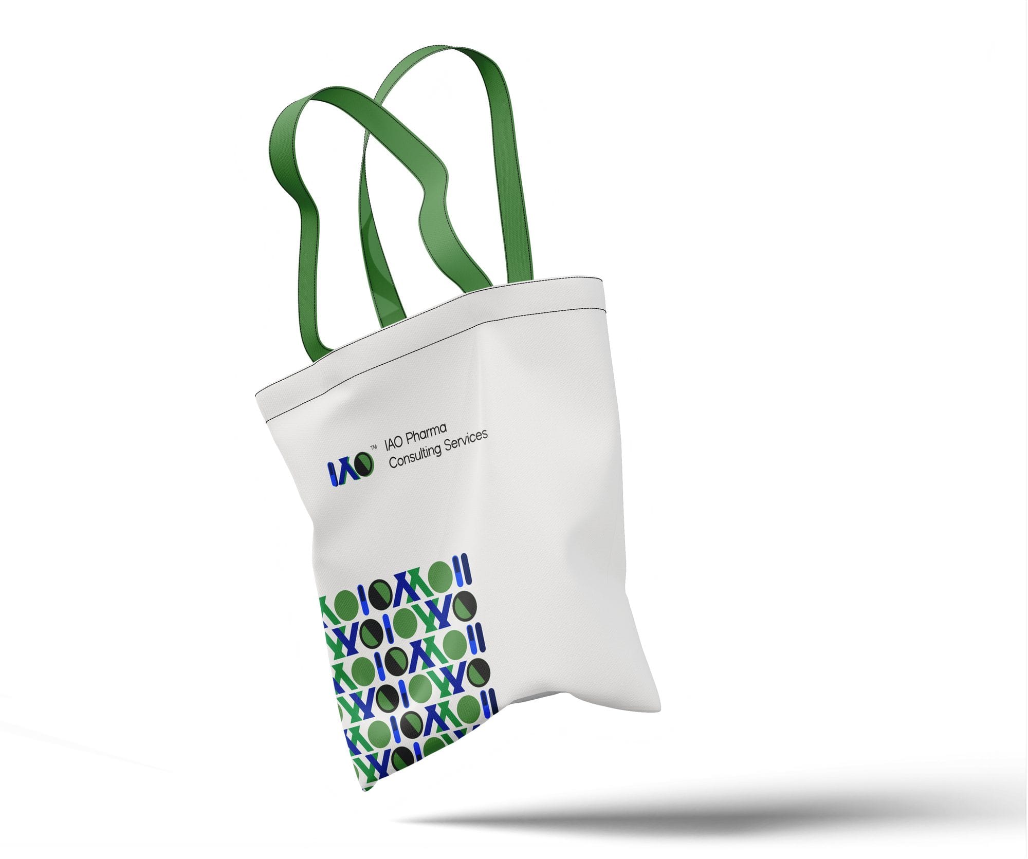 Canvas tote bag with green handles, IAO logo and brand pattern