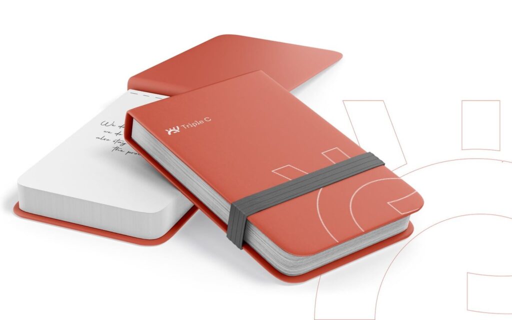 Triple C notebook with the identity on its cover