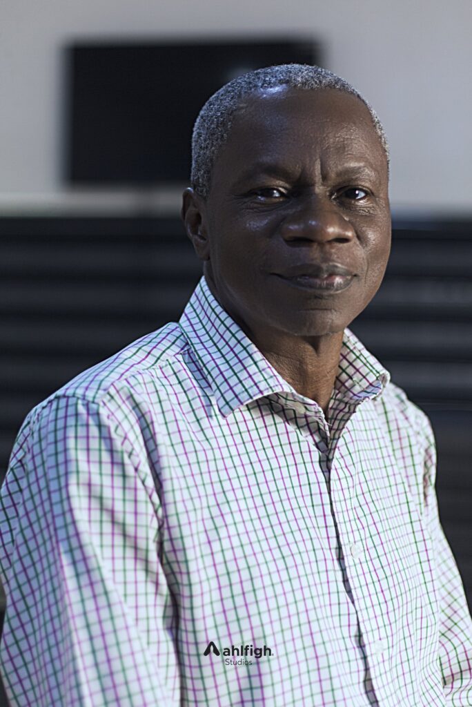 Carlos staff portrait: a senior colleague in a checked shirt