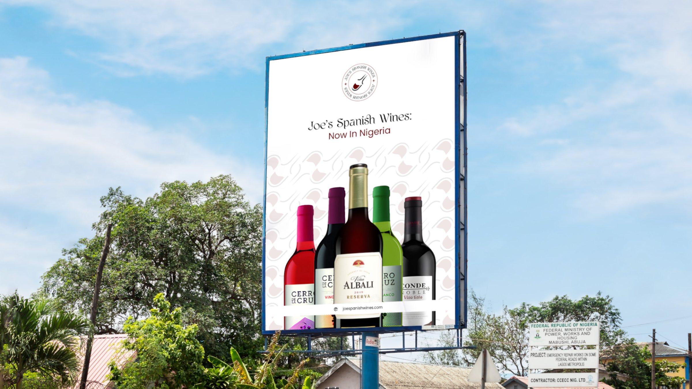 A Joe's Spanish Wines billboard by the road: now in Nigeria